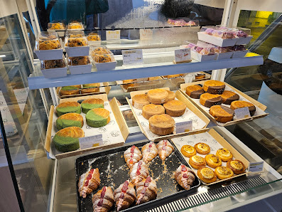 Assorted sweet pastries from Wheatz Bakery on branded paper.